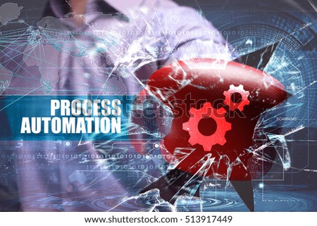 Business, Technology, Internet and network concept. Young businessman breaks the virtual future of the screen on which the inscription: process automation