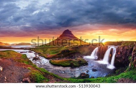 The picturesque sunset over landscapes and waterfalls. Kirkjufell mountain,Iceland  Royalty-Free Stock Photo #513930043