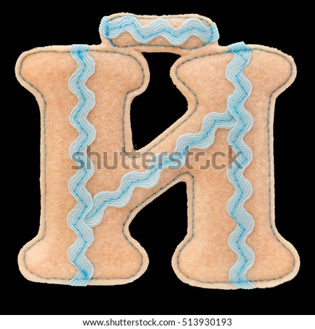 Letter of the alphabet made of felt isolated on black background. Cyrillic (Russian) alphabet set. Font for children with educational pictures