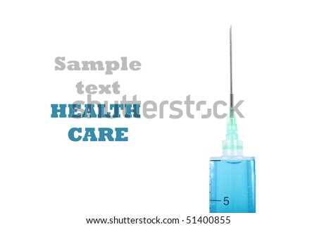 Close up of a syringe with needle filled with a blue medicine - on a pure white background with space for text