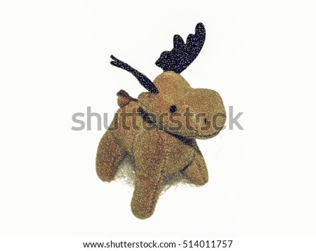 Vintage looking High key picture of Christmas moose deer in snow