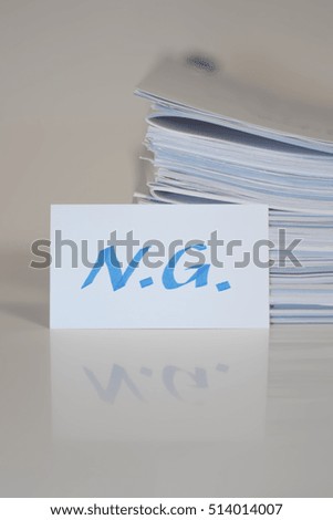 NG; Stack of Documents on white desk and Background.
