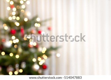christmas background with christmas tree out of focus