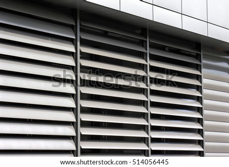           metallic   window shutter at the  office building, innovation technique  Royalty-Free Stock Photo #514056445