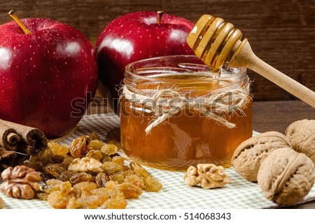 juicy red apples with cinnamon and honey on a napkin
