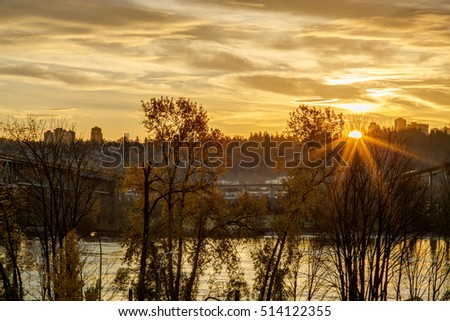 sun rises from behind the hill