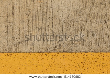 Concrete road texture with yellow line