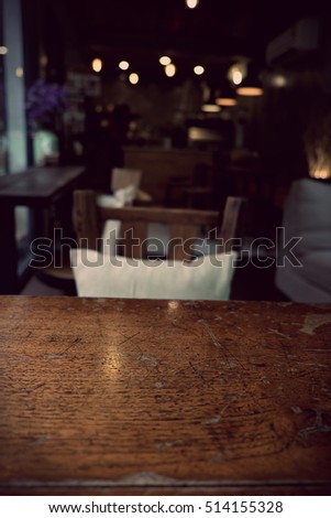 Top of empty wood table with Bar Cafe Restaurant blurred background, product display template, Business presentation