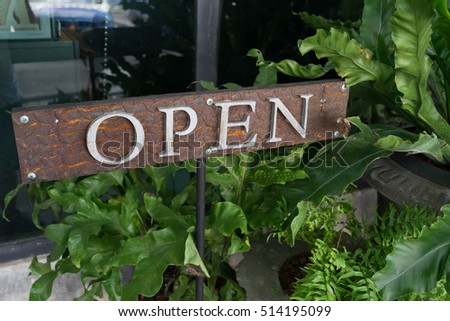 Open signs in the garden
