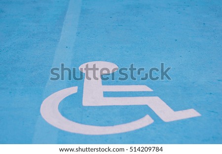Select focus sign for people with disabilities on car park outdoor