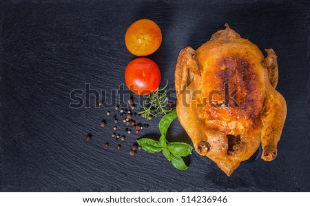 Thanksgiving concept with roasted Turkey, tomato, dry peppers, rosemary and green basil leaves, flat design,
close up
