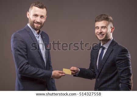 Two men with blank card in his hand