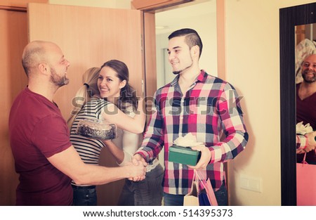 Ordinary couple welcomes friends at home