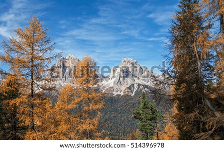 Autumn in Dolomites mountains above lake Federa.