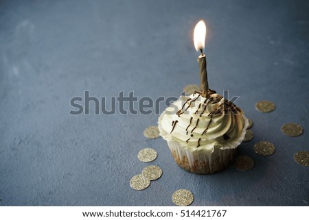 image of sweet cupcake on gray table 