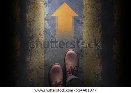 Top view, Male with Leather Shoes, Steps and follow an Arrow light on Grunge Dirty Concrete Floor Background, Way to Success for Leadership, Follow the leader Concept