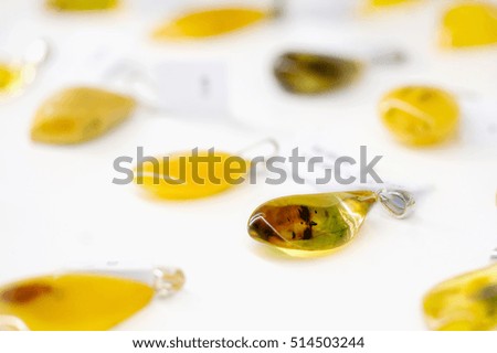 Amber pendant in a blurry background