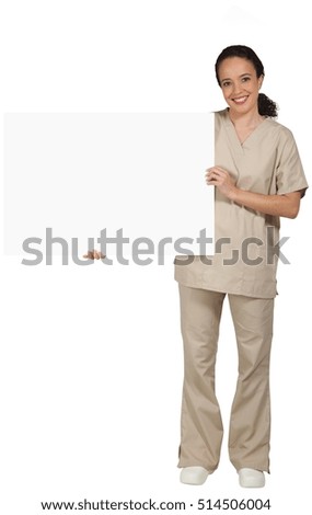 Hispanic female medical professional, in scrubs, holding a blank horizontal sign to the left.