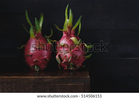 Dragon fruits on the old wood