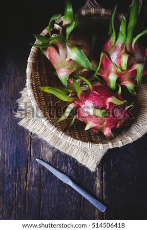 Dragon fruits on the old wood