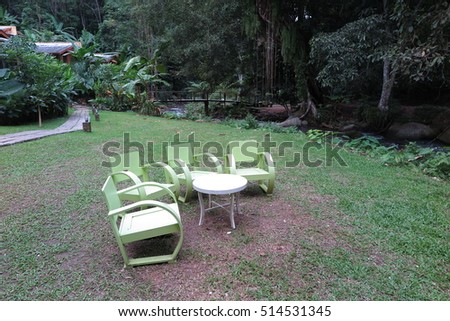 White bench near river in forest in Teen tok, Mae Kampong, Chiang Mai, Thailand
