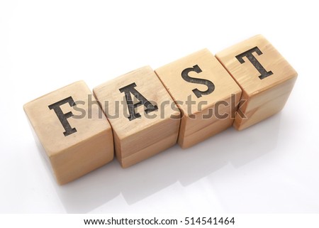 FAST word made with building blocks isolated on white