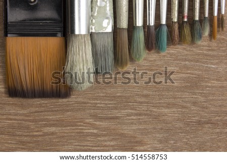 paint brushes on a wood