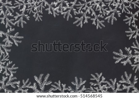 Hand drawing picture with Christmas fir branch on chalkboard. Place Your text. Holiday concept.