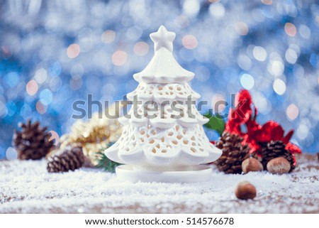 Beautiful Setting For Christmas With Tree Candle On Snowy Wooden Background With Decor. Selective Focus With Copy Space.