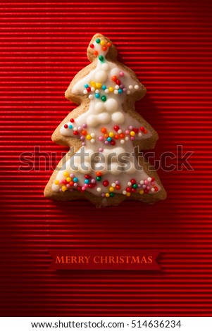 A postcard with a picture of a cookie Christmas tree for greeting your friends