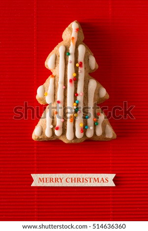 A postcard with a picture of a cookie Christmas tree for greeting your friends