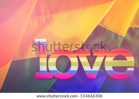 Rainbow Gay Pride flag with Love sign.