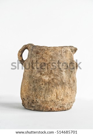 old pitcher on a white background