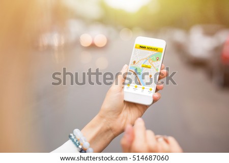 Woman using taxi app on mobile phone