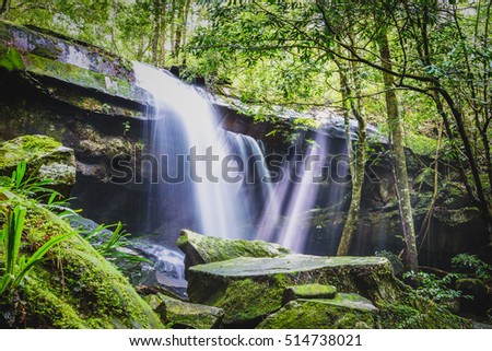 Wonderful green waterfall in deep forest at national park, Thailand