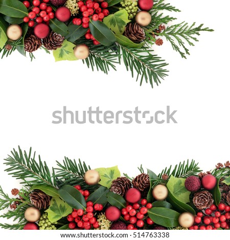 Christmas abstract background border with red and gold bauble decorations, holly with berries, ivy, pine cones, cedar cypress and fir leaf sprigs over white with copy space.