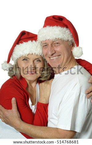 Senior couple in Santa hats