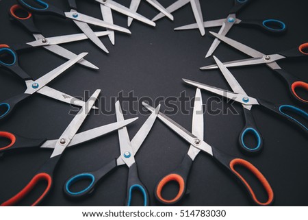 Red and blue scissors are on table