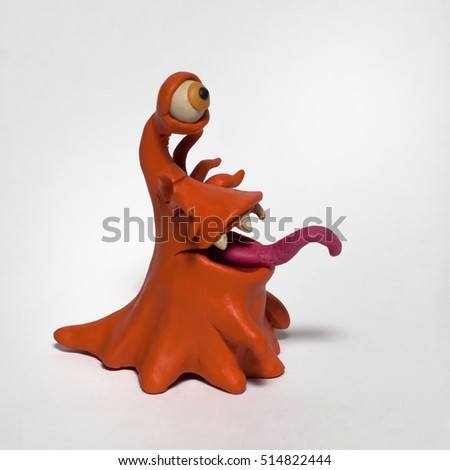 
Cobbled together from plasticine funny original monsters. Isolated character on white background Royalty-Free Stock Photo #514822444