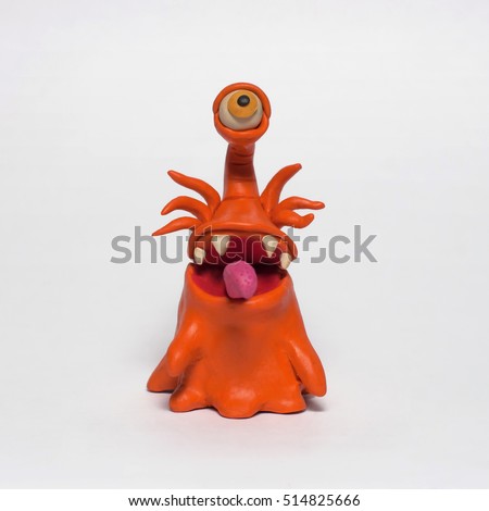 
Cobbled together from plasticine funny original monsters. Isolated character on white background Royalty-Free Stock Photo #514825666