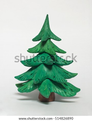 
Beautiful green Christmas tree without ornaments. The tree of plasticine on a white background Royalty-Free Stock Photo #514826890