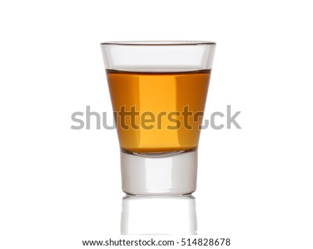 A small shot glass of delicious  whiskey Royalty-Free Stock Photo #514828678