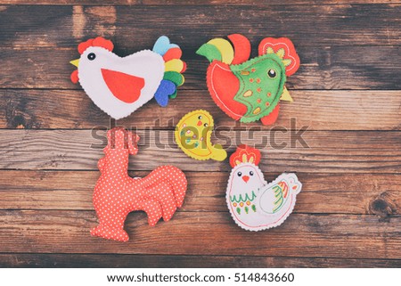 the  chicken family on the wooden background