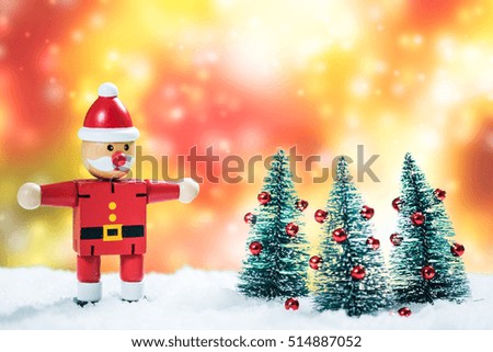 Santa and Christmas trees in snow