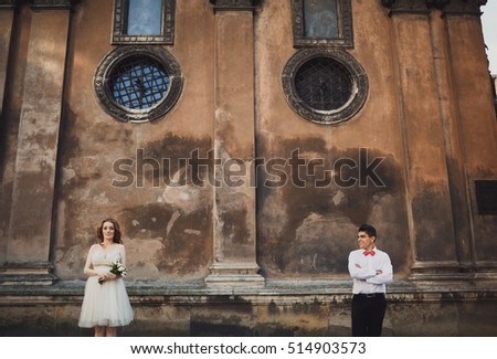 The couple in love stands   near building