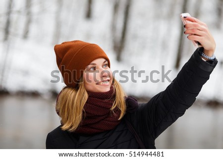 Girl doing selfie in park
