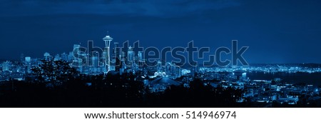 Seattle city skyline at night with urban office buildings viewed from Kerry Park.