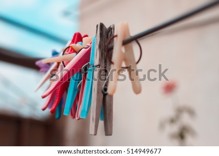 wooden clothespin hanging on rope, depth of field