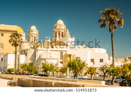 Beautiful view of Cadiz with cathedral and Iglesia Santa Cruz. Bright travel picture of sunny Andalusia.