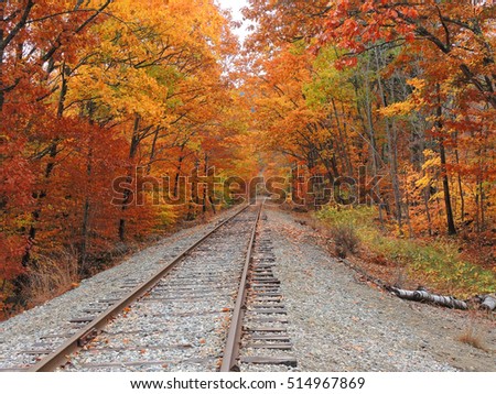 Train tracks lead into a colorful fall landscape  near Kancamagus Highway in New Hampshire's White Mountain region.    